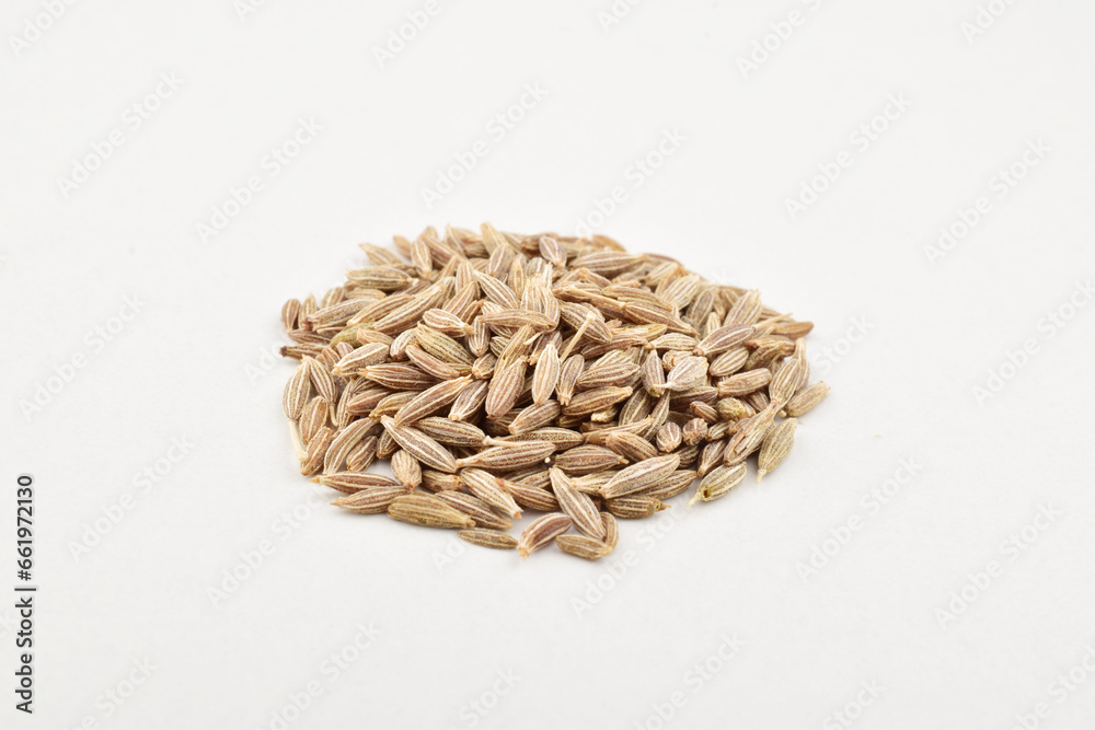 Closeup of cumin seeds on white background Closeup of cumin seeds on white background