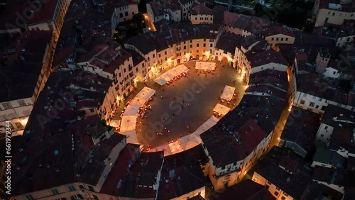 Illuminated Piazza dell'Anfiteatro, Lucca aerial view, Tuscany, Italy