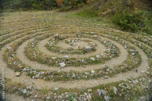 Canvastavla Circular labyrinths on the ground of grass and stones near the Konepruske cave