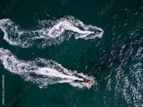Aerial view of a personal watercraft speeding through the waves,