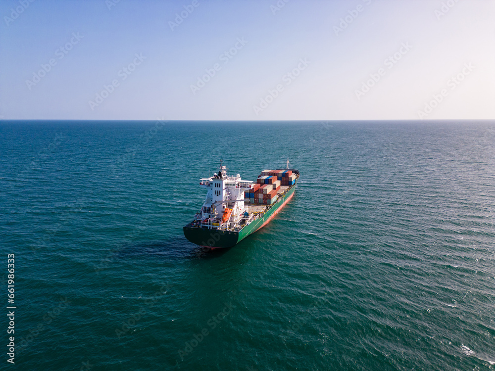 A container ship in the sea, aerial view