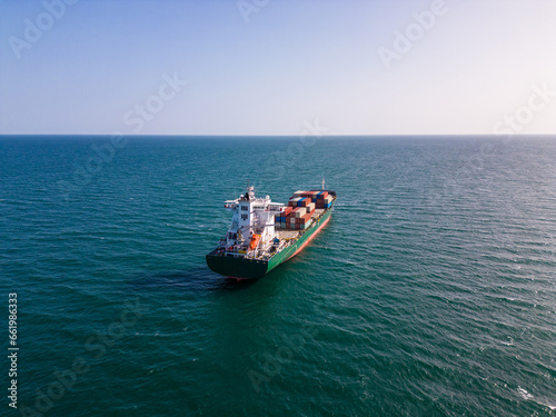 A container ship in the sea, aerial view
