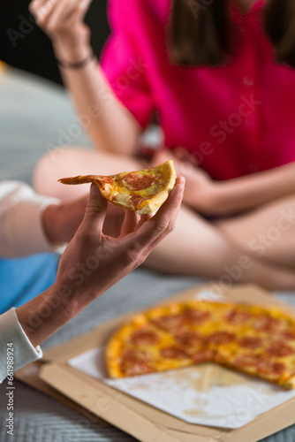 eating  slice of pizza at home with family © Bartomiej
