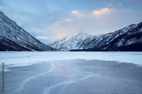 Snow-covered winter mountain lake, Russia, Siberia, Altai mountains. Multinskie lakes.