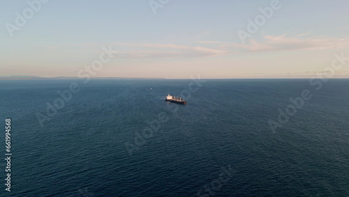 Barge carrier floating ocean surface drone view. Container tanker moving in sea © stockbusters