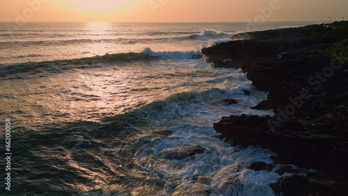 Stormy sea splashing landscape at evening coast. Dark surf breaking in nature