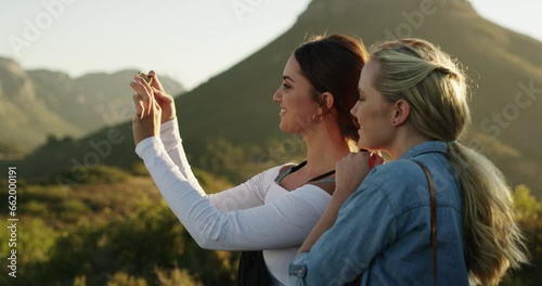 Women, landscape and phone for photography of mountain, nature and tourist outdoor for adventure or vacation. Smartphone, people and sightseeing Cape Town on holiday, travel or friends for scenery photo