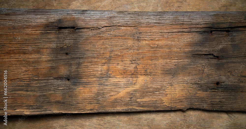 Fototapeta premium An old board from a pirate ship.Wooden background made of vintage wood.The wreck of an old ship.