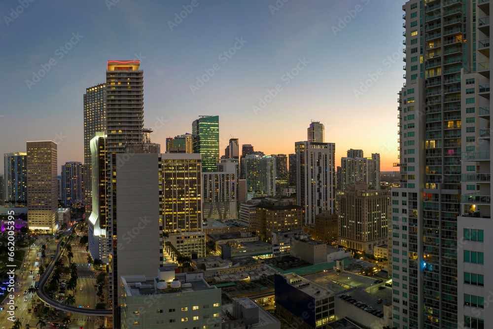Obraz premium Aerial view of downtown office district of of Miami Brickell in Florida, USA at night. High commercial and residential skyscraper buildings in modern american megapolis