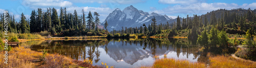 Fototapeta Naklejka Na Ścianę i Meble -  Picture Lake with snow-capped Mount Shuksan in the background showing autumn colors. Home to one of the most photographed vistas in America and even more special during the fall season. 