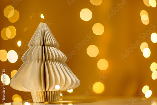 Handmade Christmas tree in Scandinavian style with magical background. Greeting card