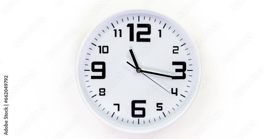 Clock face time lapse on white background with copy space for your own text. Clock time ticking on a classic Wall Clock. Shadows moving over the Watch. Half of a Clock dial close-up isolated. Concept Clock face time lapse on white background with copy space for your own text. Clock time ticking on a classic Wall Clock. Shadows moving over the Watch. Half of a Clock dial close-up isolated. Concept