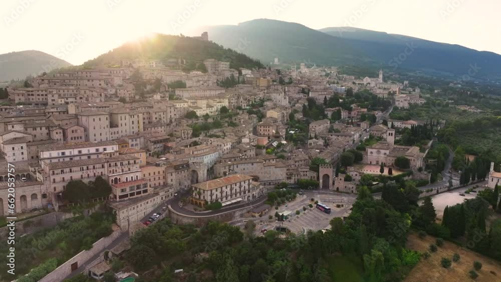 Aerial view of Assisi medieval town, Rocca Maggiore, Santa Maria sopra Minerva Church, Cathedral of San Rufino, summer morning, Umbria, Italy Aerial view of Assisi medieval town, Rocca Maggiore, Santa Maria sopra Minerva Church, Cathedral of San Rufino, summer morning, Umbria, Italy