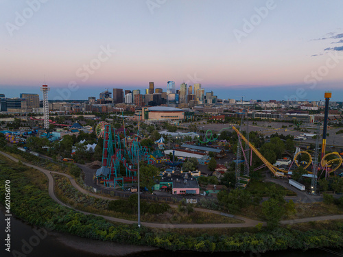 Elitch Gardens amusement park sits beneath the Denver skyline at sunset