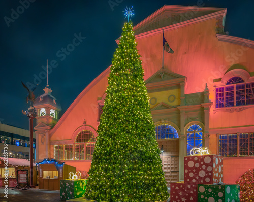 Giant illuminated Christmas tree and gifts decorations, Christmas market during winter holidays, Lansdowne Park, Ottawa, Ontario, Canada. Photo taken in December 2022.