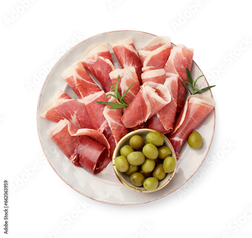 Fototapeta Naklejka Na Ścianę i Meble -  Plate with rolled slices of delicious jamon, olives and rosemary isolated on white, top view