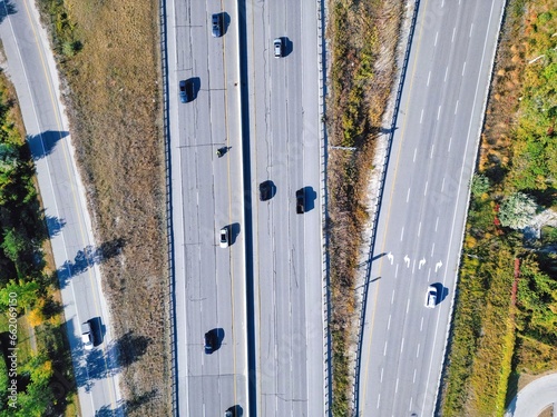 Photography Aerial view of busy highway 400 road with fast moving traffic and exit around Great Toronto Area
