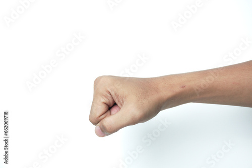 Man hand shows wrong fist gesture isolated on white background, with clipping path. Five fingers. Full Depth of field. Focus stacking