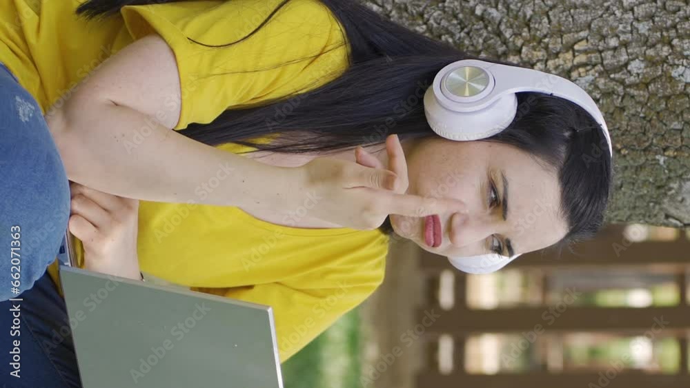 Vertical Video of Thoughtful woman looking at laptop. Vertical Video of Thoughtful woman looking at laptop.