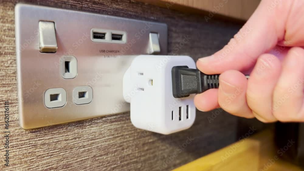 A closeup view of an electrical outlet power converter in London.  	