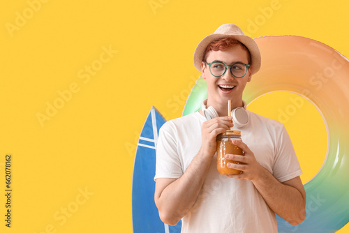 Young man with glass of jui...
