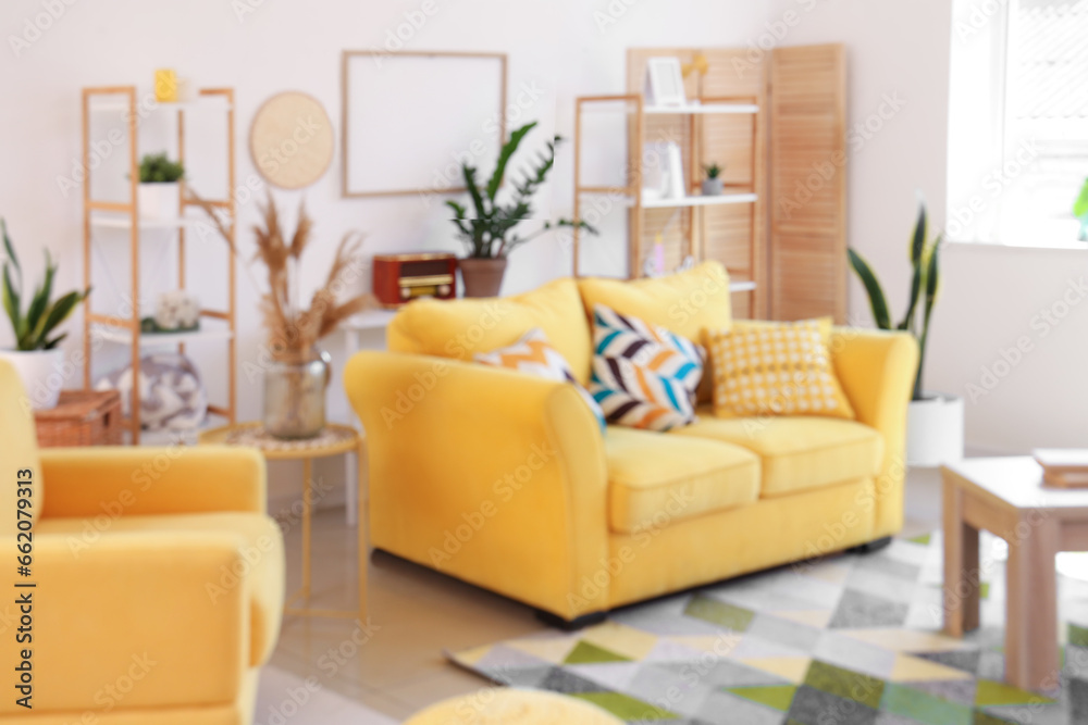 Obraz premium Interior of light living room with yellow sofa and tables