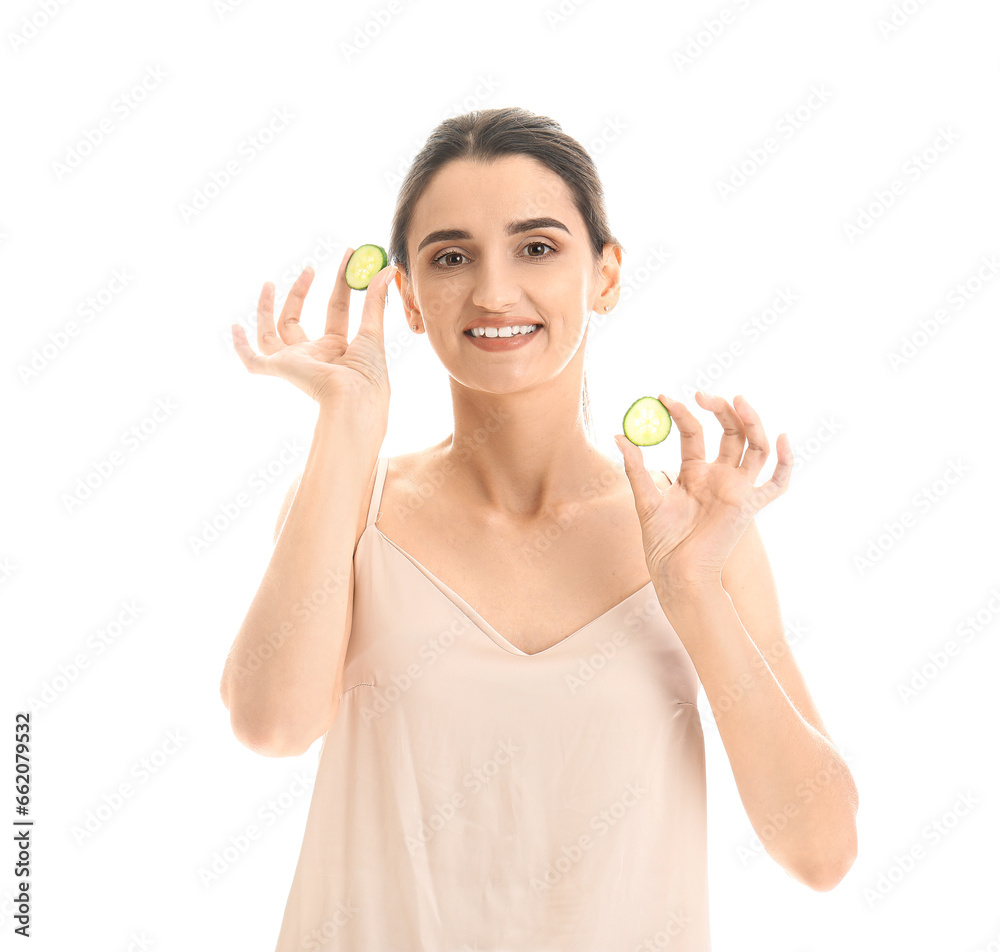 Young woman with cucumber slices on white background Young woman with cucumber slices on white background
