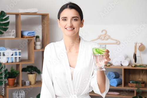 Young woman with glass of c...