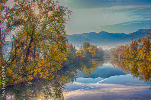 Reflactions on a foggy fall morning on the Nolichucky River in Tennessee photo