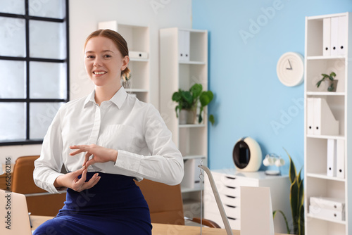 Young businesswoman meditat...