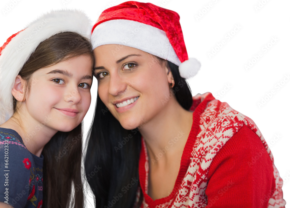 Digital png photo of happy caucasian woman and girl in santa hats on transparent background Digital png photo of happy caucasian woman and girl in santa hats on transparent background