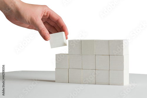 Digital png photo of hand holding brick on transparent background