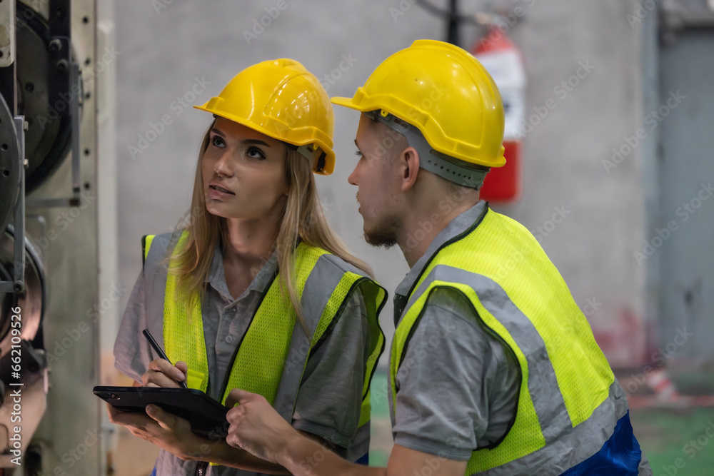 Techs inspecting, maintaining cardboard machine for safety, uninterrupted, high-quality production. Techs inspecting, maintaining cardboard machine for safety, uninterrupted, high-quality production.