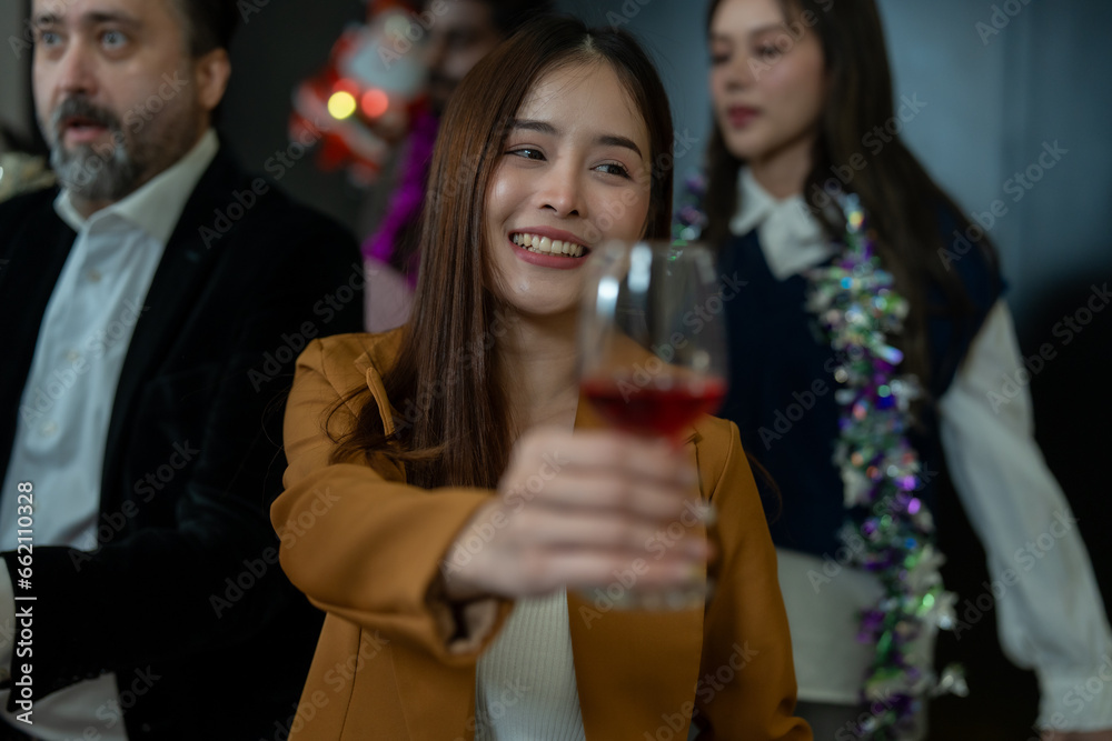 Group of office workers celebrate Christmas and New Year by dancing and drinking wine. Group of international friends and boss dancing with employees. Group of office workers celebrate Christmas and New Year by dancing and drinking wine. Group of international friends and boss dancing with employees.