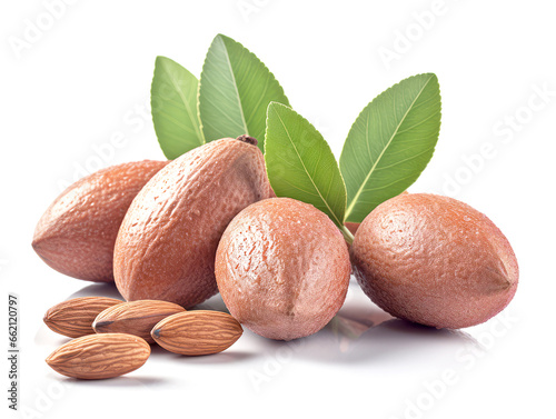 Almond nuts with leaves isolated on white background.