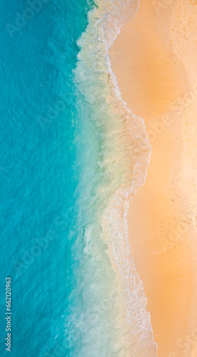 Peaceful aerial wide beach landscape, summer vacation Mediterranean holiday. Waves crash amazing blue ocean bay sea panoramic coastline. Tranquil aerial drone top view. Relaxing sunny beach, seaside