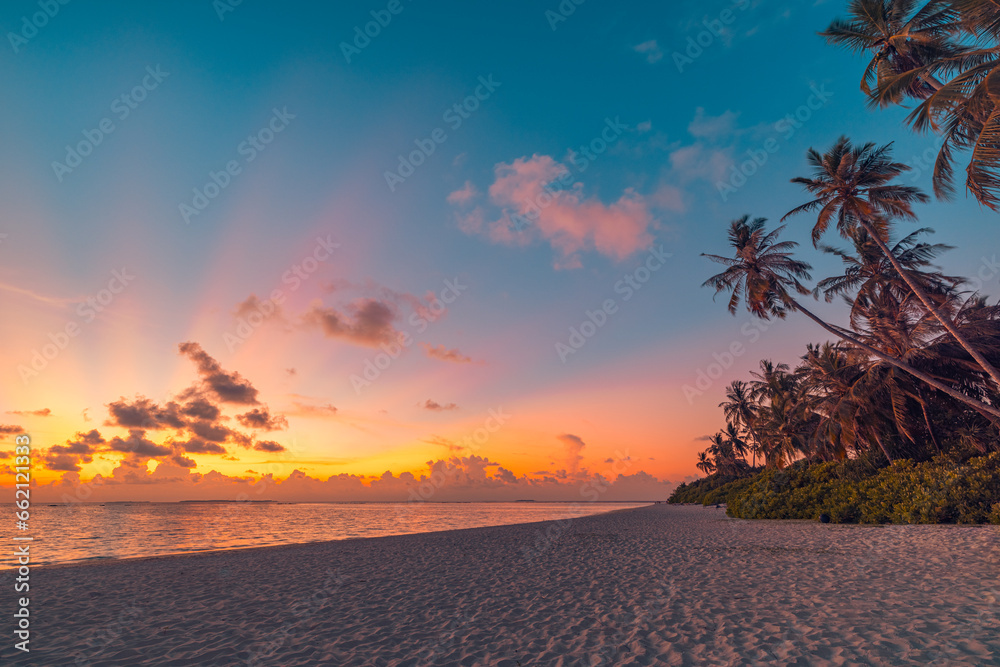 Best island beach. Silhouette palm trees panoramic destination landscape. Inspire sea sand popular vacation tropical beach seascape horizon. Orange gold sunset sky. Calm tranquil relax summer travel