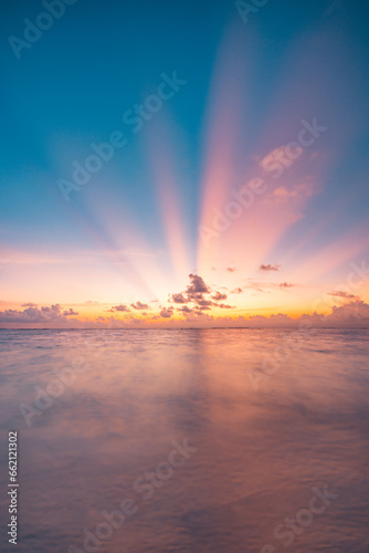 Dramatic colorful sunset sky over Mediterranean sea. Clouds sunrays. Cloudscape nature background. Panorama seascape, relaxing bright peaceful nature pattern. Majestic ocean view, calm water surface