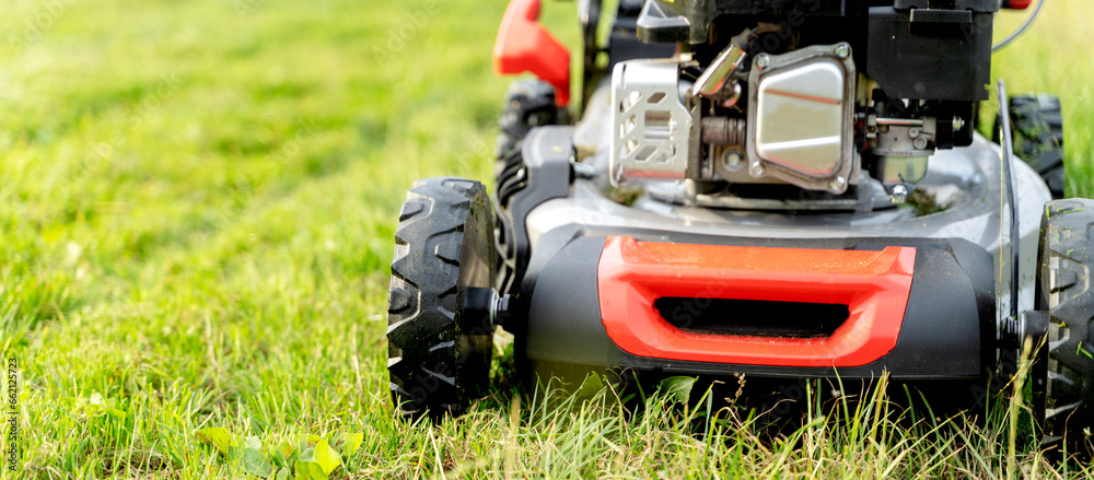 a girl with a lawn mower on a lawn lawn a girl with a lawn mower on a lawn lawn
