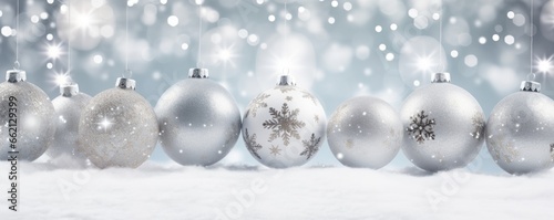Christmas background with snowflakes and christmas balls in silver and white tons