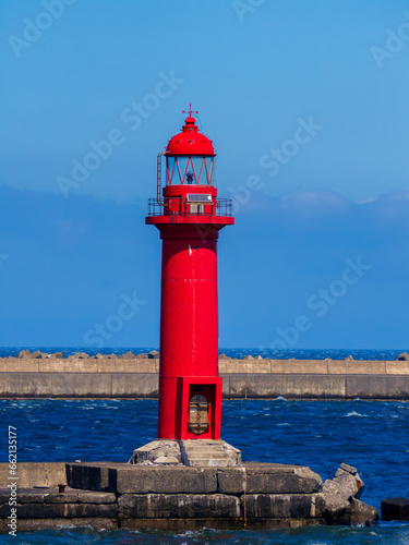 A red lighthouse standing at Wakkanai Port in Wakkanai City, Hokkaido, Japan
