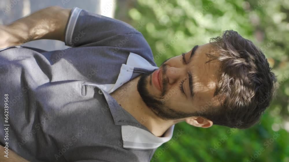 Vertical Video of The gaze of the grieving dwarf young man. Vertical Video of The gaze of the grieving dwarf young man.