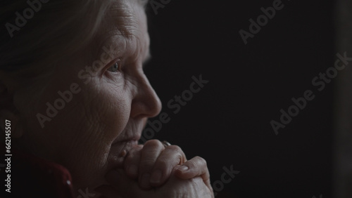 Bilde på lerret shot of old woman sitting near window and nods