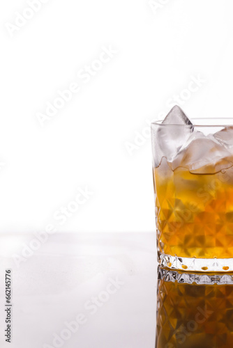 whiskey in a glass filled with ice cubes