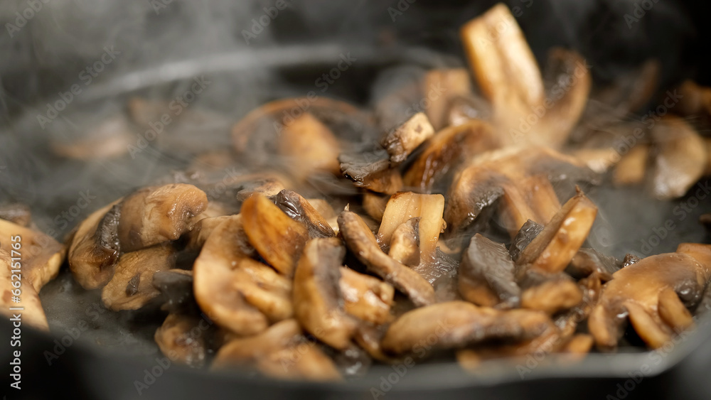 Fried champignons mushrooms in pan Fried champignons mushrooms in pan