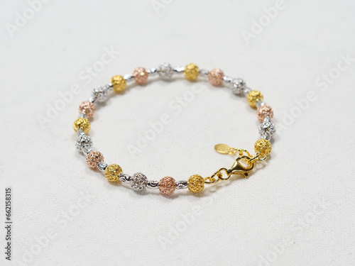 Silver bracelet display on white cloth background