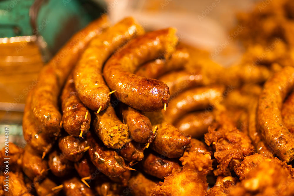 Thai sausage grilled on stall in night market in Chiang Mai, Thailand 