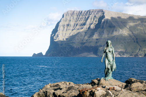 Statue of Kopakonan (the Seal Woman), Mikladalur village, Faroe Islands photo