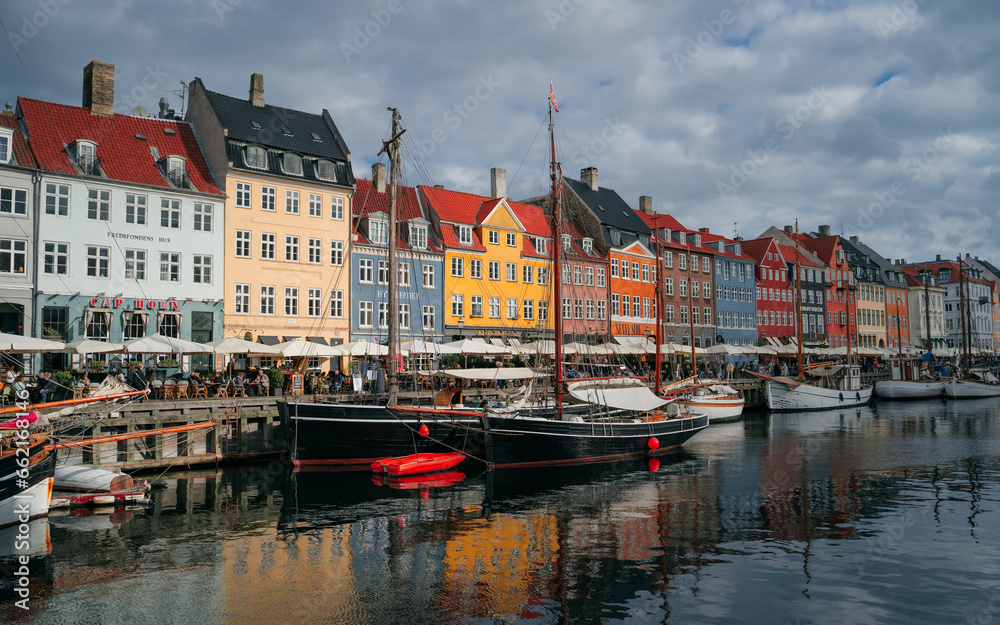 Copenhagen iconic view. Famous old Nyhavn port in the center of Copenhagen, Denmark during winter sunny day