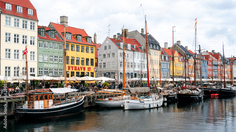 Copenhagen iconic view. Famous old Nyhavn port in the center of Copenhagen, Denmark during winter sunny day